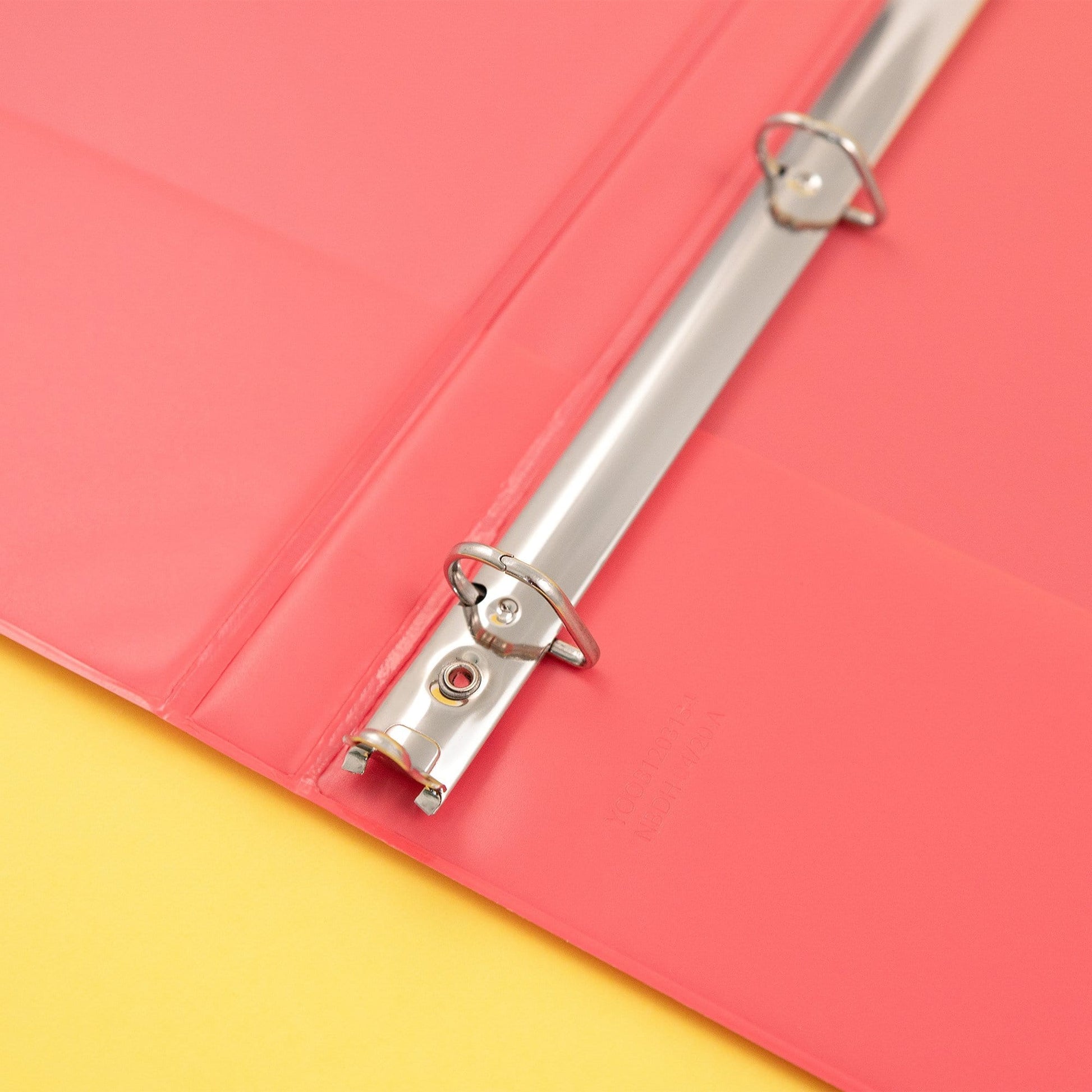 inside of open 3-ring binder showing D-ring detail inside binder