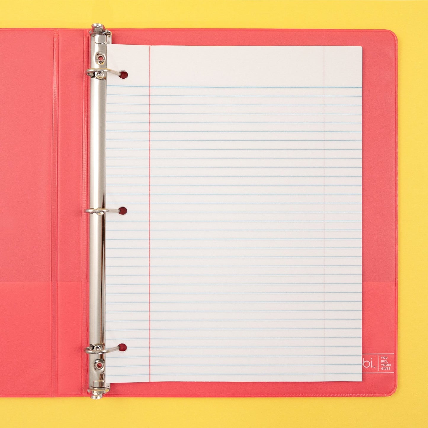 inside of open 3-ring binder showing 3-hole punched college-ruled paper inside binder