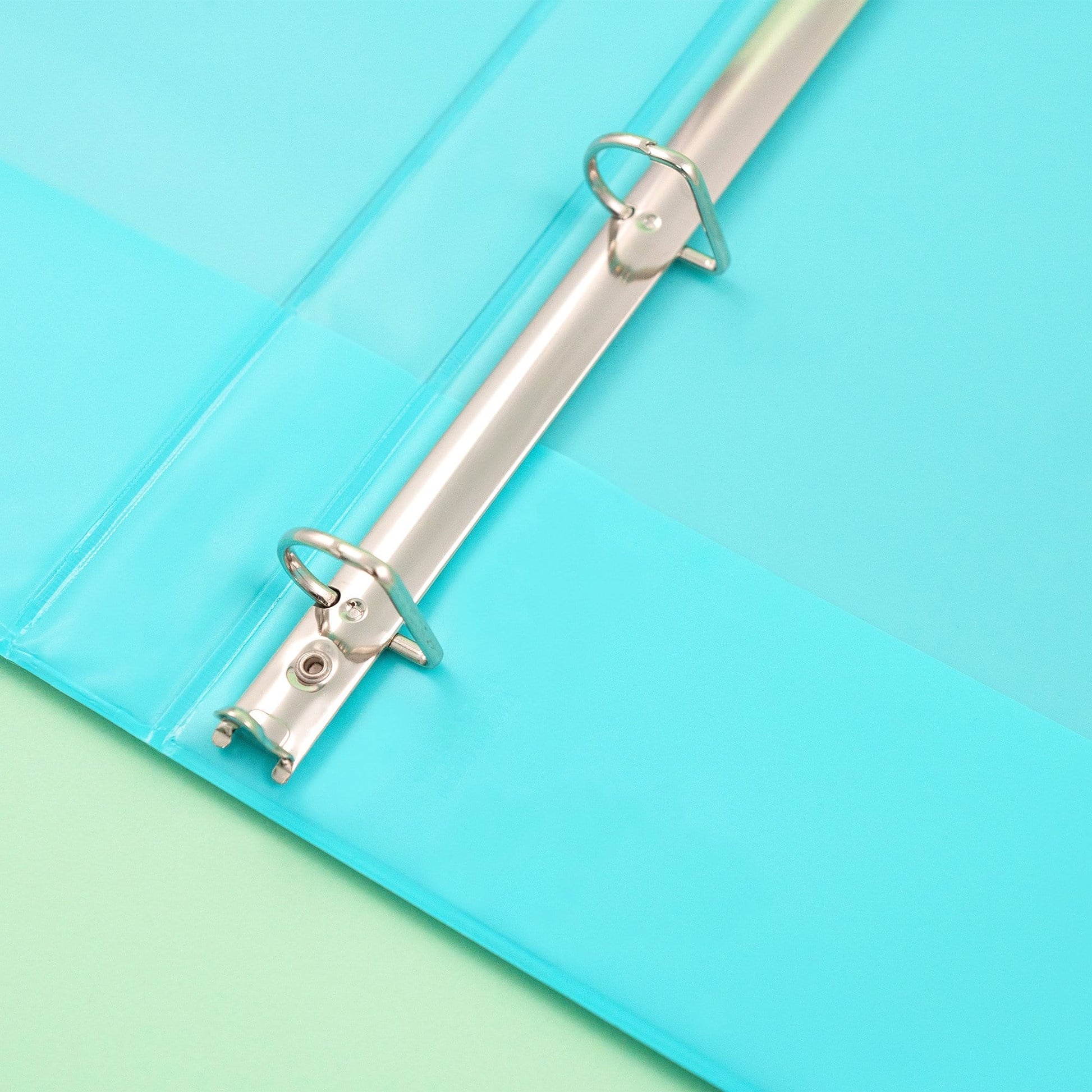 inside of open 3-ring binder showing D-ring detail inside binder